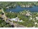 Aerial view of lake and community pool with lake side homes at 320 Dodd Ln, Alpharetta, GA 30005