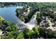 Breathtaking aerial view showcases a lake, waterfront homes, and lush green landscape at 320 Dodd Ln, Alpharetta, GA 30005