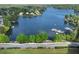 Aerial view of a serene lake showcasing boats, houses, and a lush green shoreline at 320 Dodd Ln, Alpharetta, GA 30005