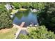 Picturesque aerial view of a boat launch area with dock, boats, and lush surroundings at 320 Dodd Ln, Alpharetta, GA 30005