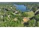 Scenic aerial showcasing a lakefront community with lush greenery, a baseball field, and a tranquil lake at 320 Dodd Ln, Alpharetta, GA 30005
