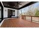 Covered deck featuring a ceiling fan and railing at 320 Dodd Ln, Alpharetta, GA 30005