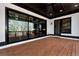 Large covered back deck with outdoor lighting and large windows at 320 Dodd Ln, Alpharetta, GA 30005