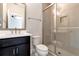 Bathroom featuring frameless glass shower, modern fixtures, and sleek vanity at 320 Dodd Ln, Alpharetta, GA 30005
