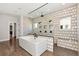 Luxurious bathroom with a soaking tub, glass shower, unique tile work, and modern fixtures at 320 Dodd Ln, Alpharetta, GA 30005
