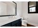 Bathroom with blue vanity, quartz countertop, and modern fixtures, providing a stylish and functional space at 320 Dodd Ln, Alpharetta, GA 30005