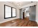 Bedroom boasts hardwood floors, natural light from the windows, and a sliding barn door at 320 Dodd Ln, Alpharetta, GA 30005