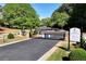 Windward Lake community entrance with a gate, signage, and well-maintained landscaping at 320 Dodd Ln, Alpharetta, GA 30005