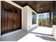 Close-up of the front porch featuring a double wood door and white painted brick at 320 Dodd Ln, Alpharetta, GA 30005