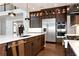 Gourmet kitchen featuring stainless appliances, a marble countertop island, and custom cabinets at 320 Dodd Ln, Alpharetta, GA 30005
