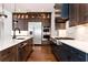 Well-equipped kitchen featuring stainless appliances, a marble countertop island, and designer cabinets at 320 Dodd Ln, Alpharetta, GA 30005