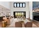Inviting living room with soaring ceilings, a cozy fireplace, and an open layout perfect for entertaining at 320 Dodd Ln, Alpharetta, GA 30005