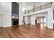 Spacious living room featuring hardwood floors, fireplace, and an open-concept design with natural light at 320 Dodd Ln, Alpharetta, GA 30005