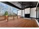 Large covered patio with stained wood deck, fireplace and ceiling fan at 320 Dodd Ln, Alpharetta, GA 30005