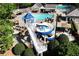 Aerial view of community pool featuring a slide and sitting areas at 320 Dodd Ln, Alpharetta, GA 30005