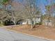 Two-story home with an attached two-car garage, green shutters, and a nice front yard at 4401 Shiloh Hills Dr, Snellville, GA 30039