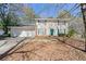 Charming two-story home featuring a two-car garage, green shutters, and a well-maintained front yard at 4401 Shiloh Hills Dr, Snellville, GA 30039