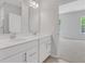 Bathroom featuring a double sink vanity with quartz countertops and modern fixtures, and tile flooring at , Mcdonough, GA 30253