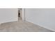 Bright bedroom featuring neutral walls, carpet, and an open doorway at , Mcdonough, GA 30253