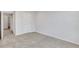 Spacious bedroom with neutral carpet, paint, and view to a doorway with access to other rooms at , Mcdonough, GA 30253