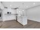 Well-lit kitchen featuring white cabinetry and a large island with a sink at , Mcdonough, GA 30253