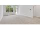 Bright living room featuring plush carpeting, neutral paint, and large windows that provide ample natural light at , Mcdonough, GA 30253