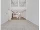 Bright and airy living room with a view of the modern kitchen and beautiful hardwood floors at , Mcdonough, GA 30253