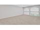 Bright and airy loft space with neutral walls, plush carpeting, and a decorative railing at , Mcdonough, GA 30253