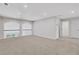 Bright and airy loft space with neutral walls, plush carpeting, and a decorative railing at , Mcdonough, GA 30253