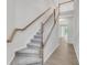 Bright staircase with carpeted steps and wooden banister at , Mcdonough, GA 30253