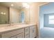 Modern bathroom with double sink vanity and a view to the bedroom at 4814 Floydwood Ln, Mableton, GA 30126