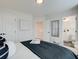 Bedroom with neutral decor, ensuite bathroom, and lots of natural light at 4814 Floydwood Ln, Mableton, GA 30126