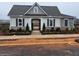 Exterior of a well-maintained clubhouse with brick accents and fresh landscaping at 4814 Floydwood Ln, Mableton, GA 30126