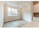Bright dining area with natural light and modern chandelier at 4814 Floydwood Ln, Mableton, GA 30126