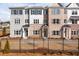 Beautiful townhome exterior featuring a mix of brick and siding, complemented by black shutters and a well-manicured front yard at 4814 Floydwood Ln, Mableton, GA 30126
