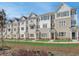 View of the stylish townhome exteriors, showcasing a modern design with brick and siding accents at 4814 Floydwood Ln, Mableton, GA 30126