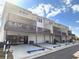 Row of new townhomes with two-car garages and second story balconies on a sunny day at 4814 Floydwood Ln, Mableton, GA 30126