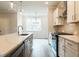 Open concept kitchen with kitchen island, stainless steel appliances and view to dining area at 4814 Floydwood Ln, Mableton, GA 30126