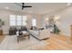 Cozy living room features lots of natural light, hardwood floors and neutral decor at 4814 Floydwood Ln, Mableton, GA 30126