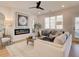 Bright and airy living room featuring hardwood floors, a fireplace, and an open layout at 4814 Floydwood Ln, Mableton, GA 30126
