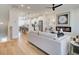 Open-concept living room with fireplace, hardwood floors and a view of the modern kitchen at 4814 Floydwood Ln, Mableton, GA 30126