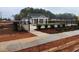 Community pool area with fence, fresh landscaping, and clubhouse in the background at 4814 Floydwood Ln, Mableton, GA 30126