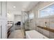 Modern bathroom featuring a walk-in glass shower, soaking tub, and sleek vanity at 560 John Wesley Dobbs Ave, Atlanta, GA 30312