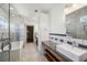Elegant bathroom featuring a glass-enclosed shower, soaking tub, and modern vanity at 560 John Wesley Dobbs Ave, Atlanta, GA 30312