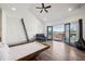 Modern bedroom with ladder and wood-burning fireplace and balcony with city views at 560 John Wesley Dobbs Ave, Atlanta, GA 30312