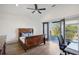 Bedroom with a wooden bed frame and a balcony with outside views at 560 John Wesley Dobbs Ave, Atlanta, GA 30312