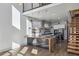 Modern kitchen features a large island, stainless steel appliances, and an open layout with wood floors at 560 John Wesley Dobbs Ave, Atlanta, GA 30312