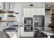 Modern kitchen featuring stainless steel appliances, concrete countertops, and subway tile backsplash at 560 John Wesley Dobbs Ave, Atlanta, GA 30312