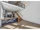 Open concept kitchen with floating staircase, stainless steel appliances, and concrete countertops at 560 John Wesley Dobbs Ave, Atlanta, GA 30312