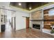 Elegant living room with modern fireplace, wood accents, and sliding barn door at 560 John Wesley Dobbs Ave, Atlanta, GA 30312